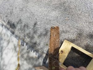Example of damaged composite decking showing surface deterioration